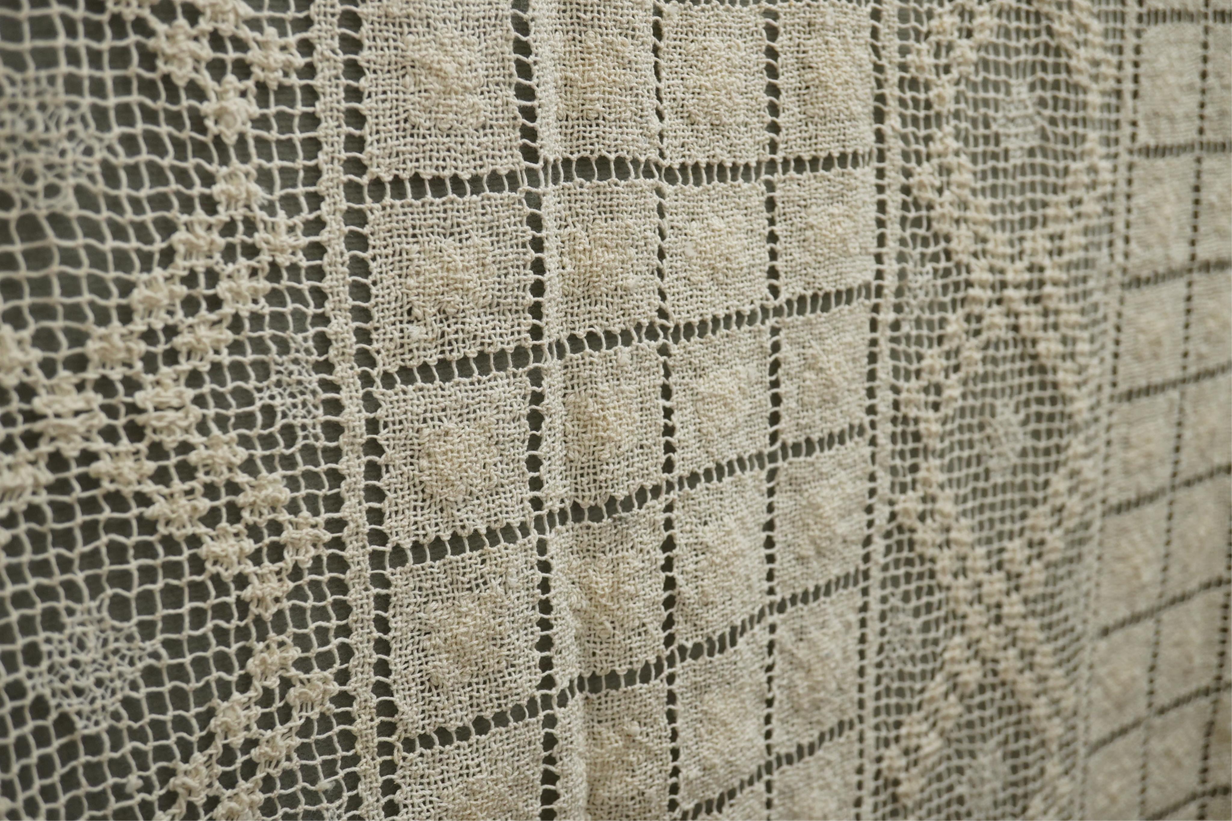 A collection of early 20th century and later crochet, cut work and drawn thread table linens and a large embroidered table cloth